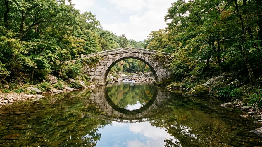 The beautiful arched stone bridge Seungseongyo at Seonamsa in Suncheon reflected in the valley stream