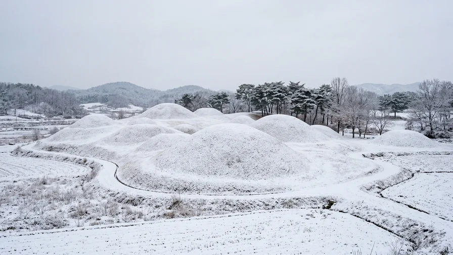 The Gaya Tumuli in snowy winter, the tomb hills in a quiet and peaceful snowscape