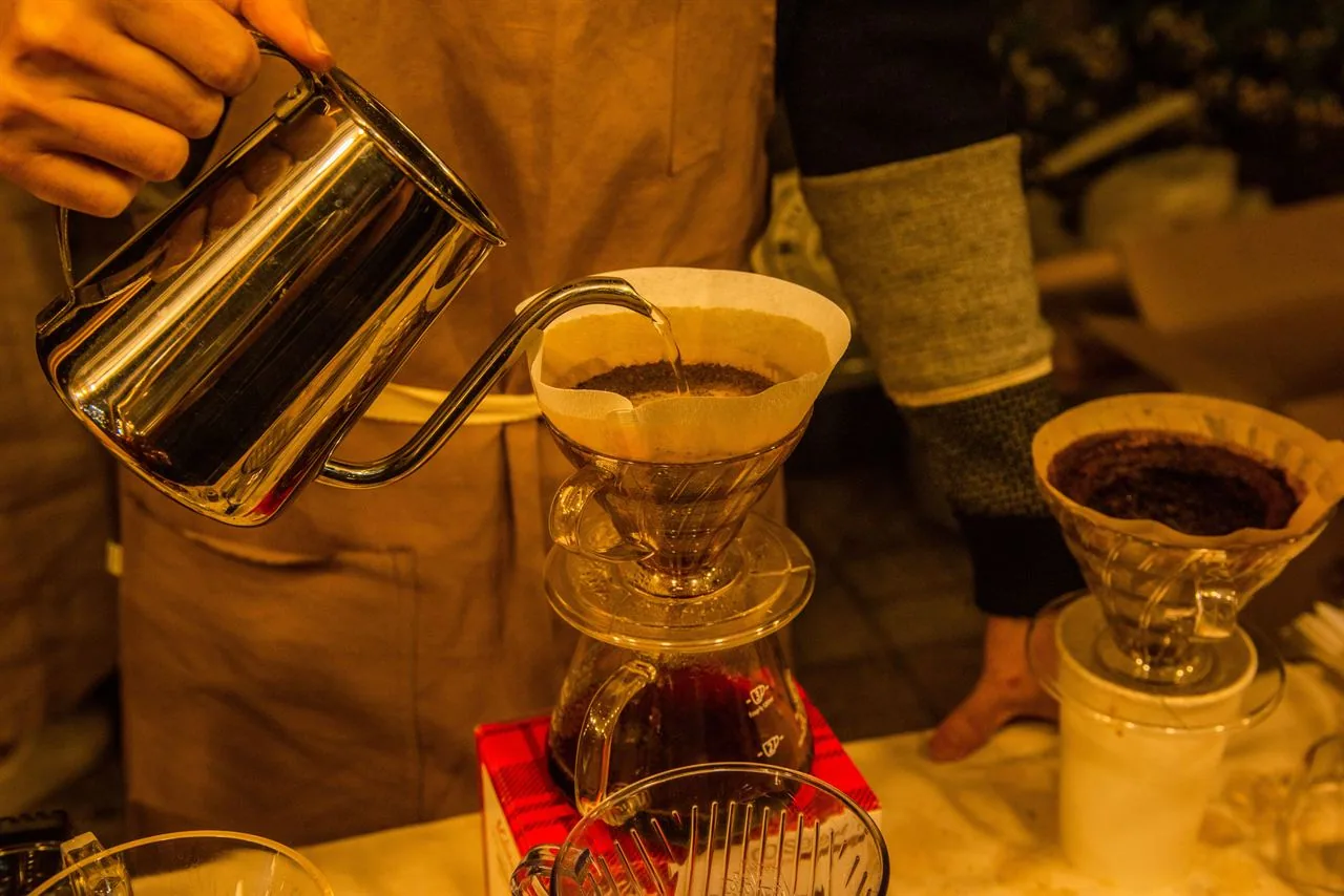 A cafe bar with a professional barista's hand-drip tools neatly arranged